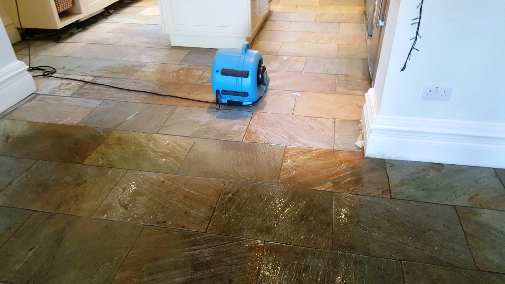 Riven slate floor during cleaning at Boston farmhouse